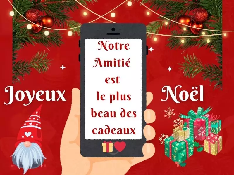 Smartphone avec message de Noël WhatsApp et décorations festives